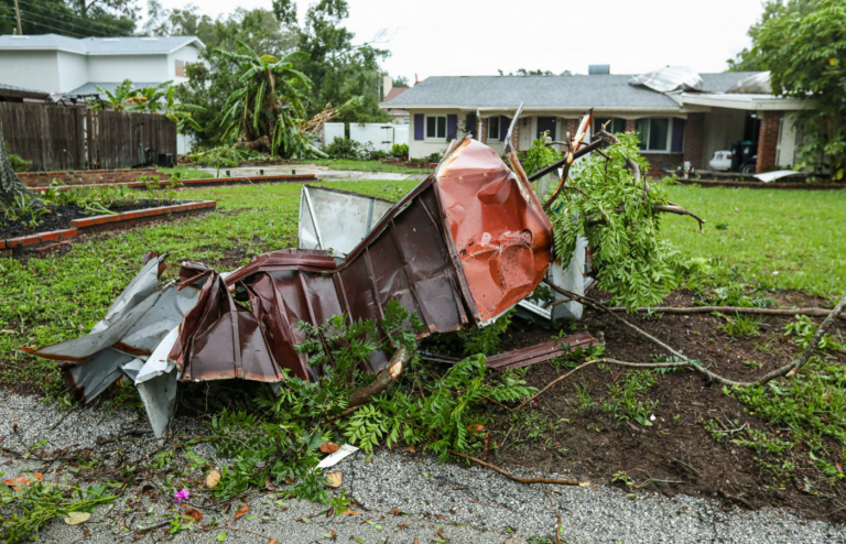A neighborhood reduced to rubble after a tornado strike.