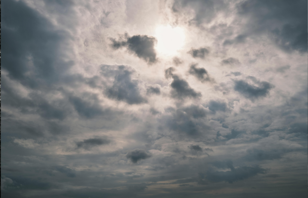Dim skies with a faint sun overhead