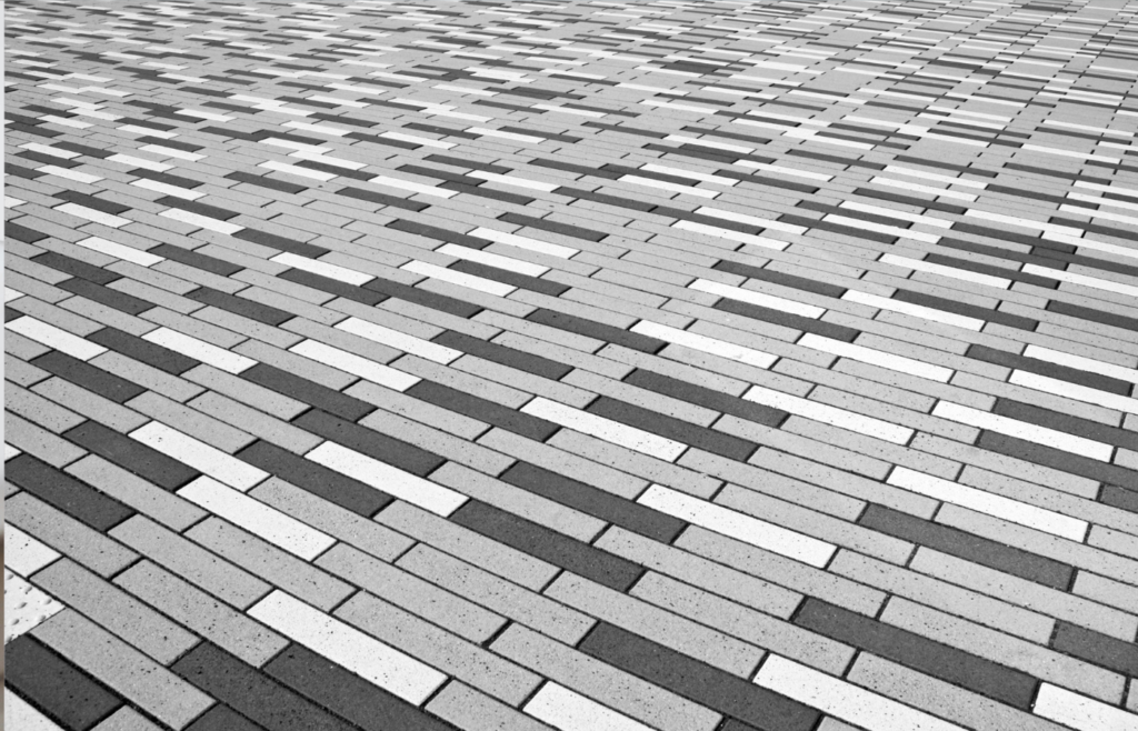A lifted floor tile revealing a small cache of emergency supplies
