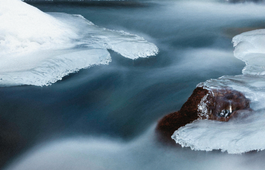 A Waterfalls with Frozen Surroundings