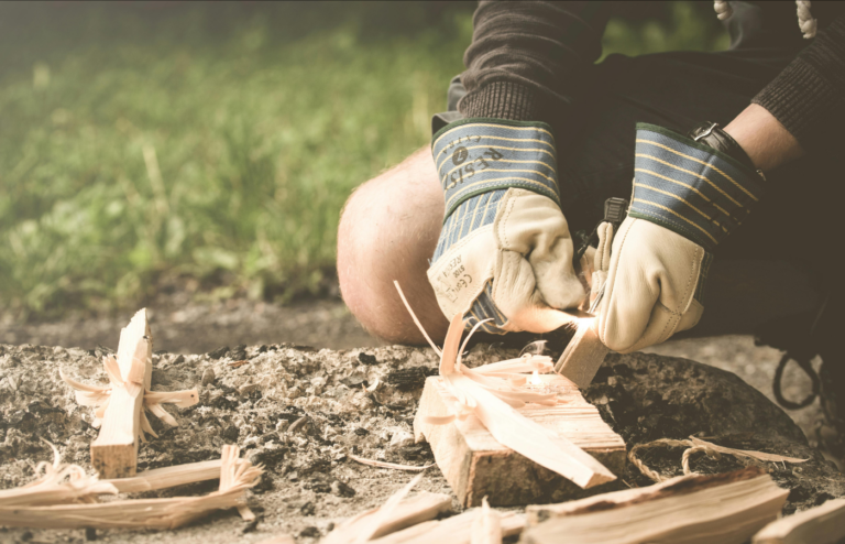 Person Curving Wood for fire