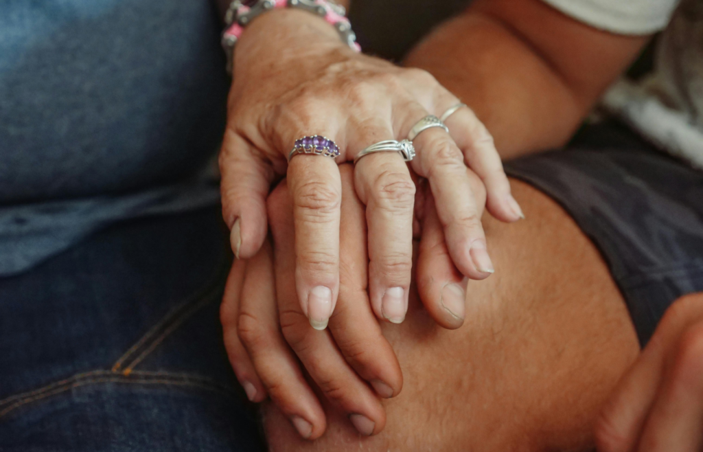 Woman holding a man's hand