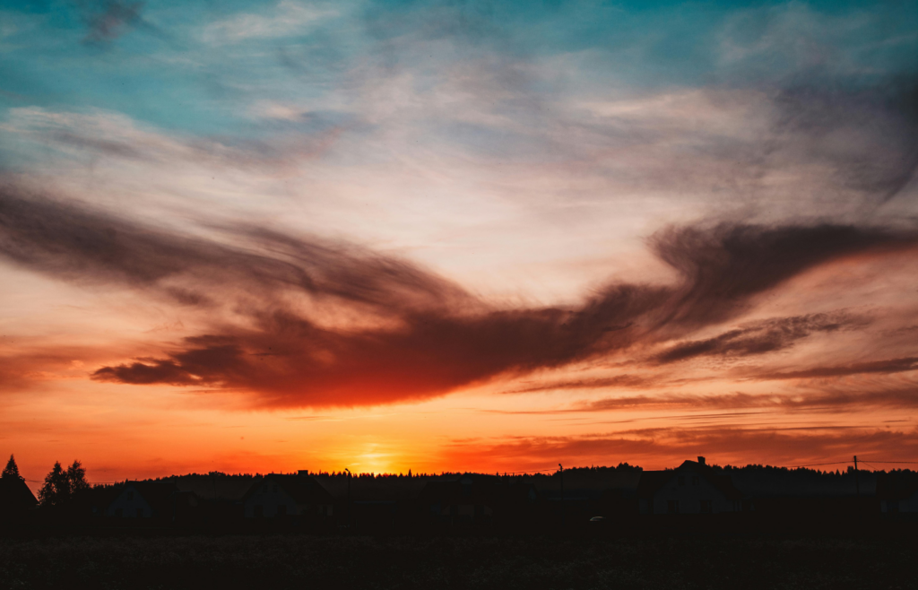 A sunset over a rural landscape