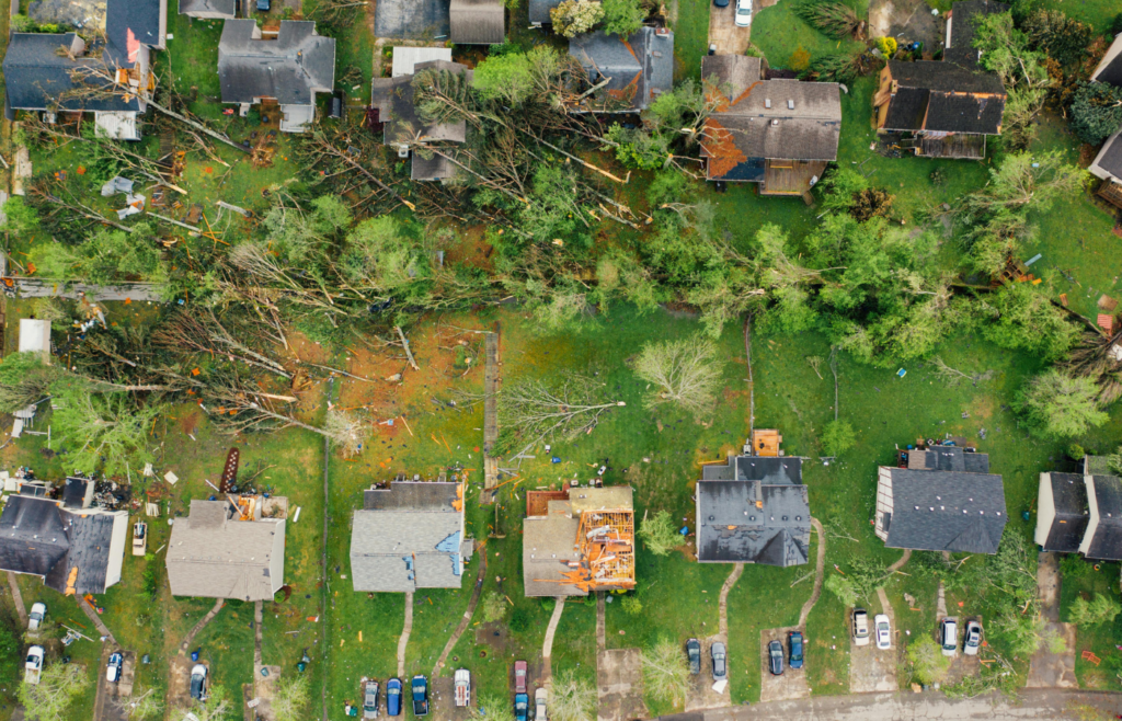 Small settlement cottages with destroyed roofs after hurricane