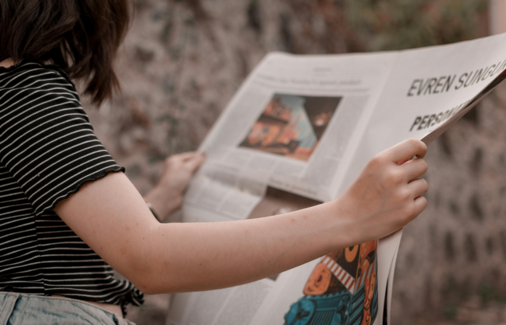 Person reading newspaper