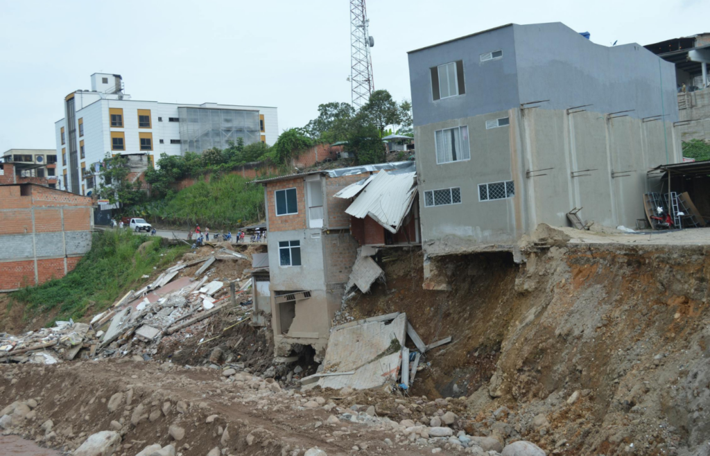 Hillside community with visible soil erosion