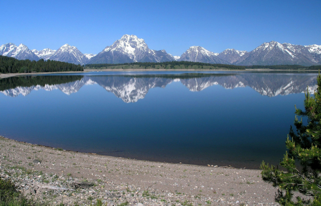 Body of Water Under Blue Sky