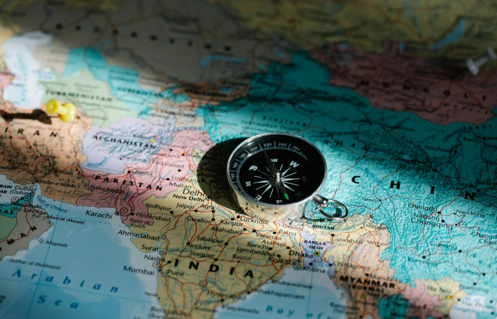 Compass Placed on a World Map