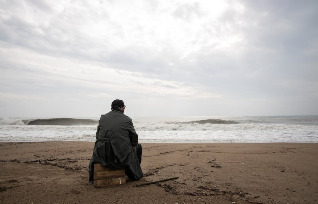 A person sitting in storm clouds