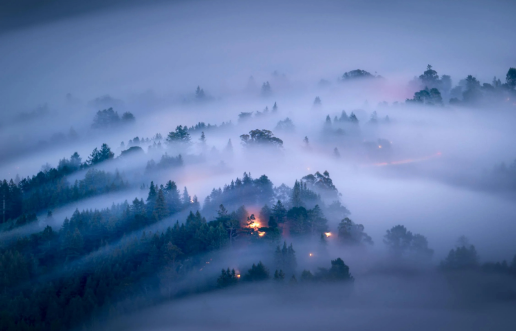 Clouds rolling over a landscape