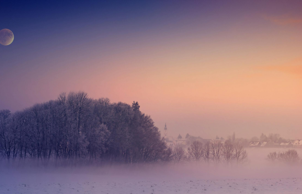Fog around the moon in the twilight sky