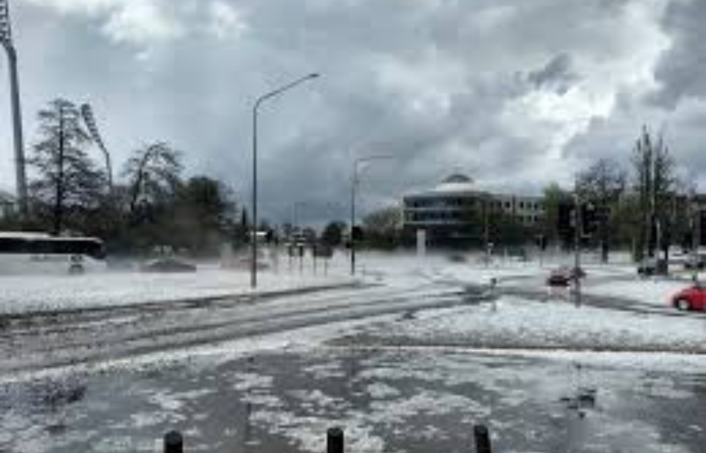 A street in Ballarat under a sudden hailstorm with dark clouds overhead