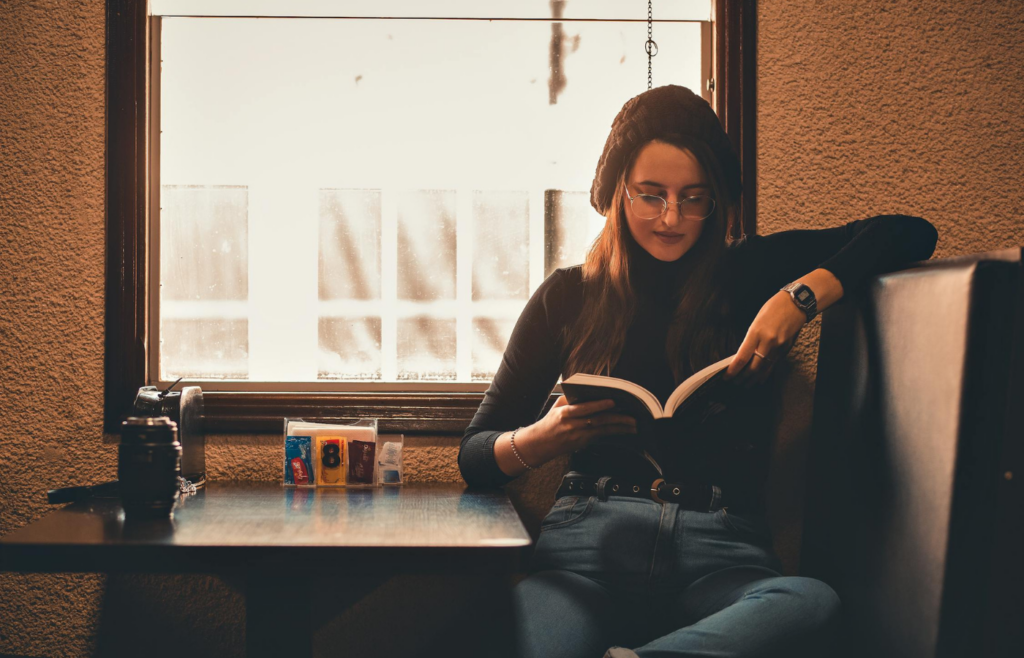 A person reading a book at home
