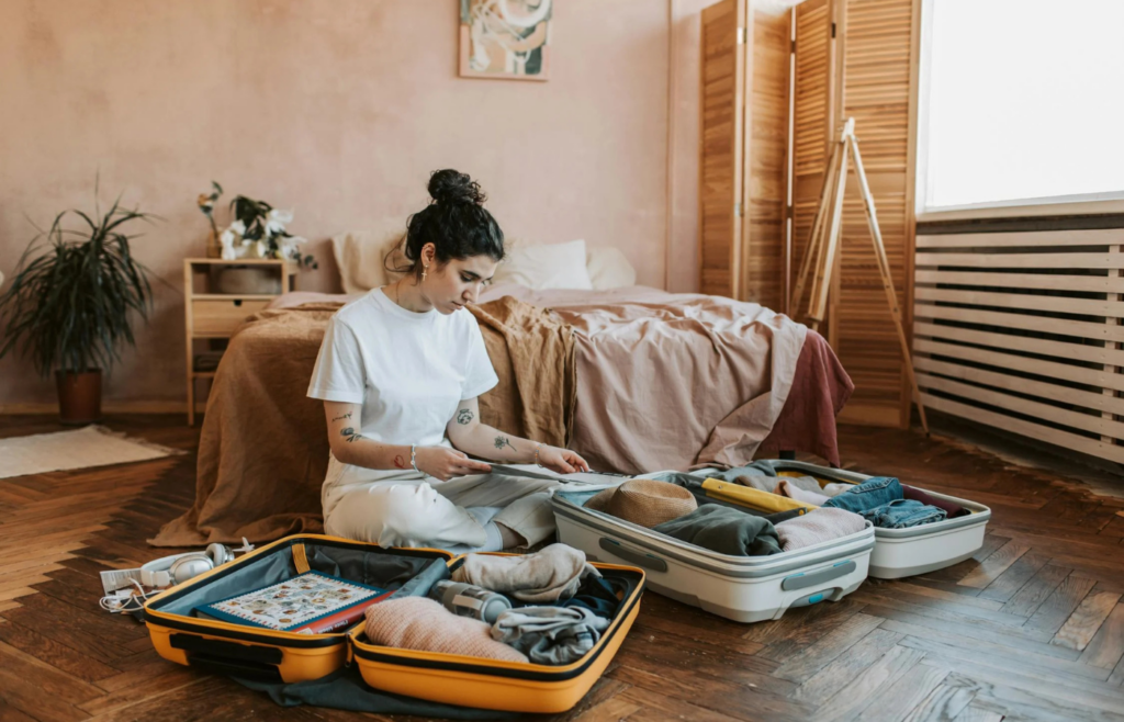 Person discreetly organizing emergency supplies at home