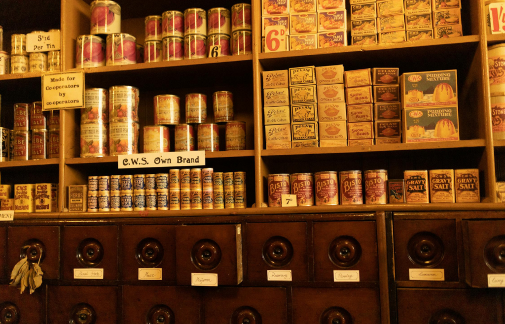 A collection of MRE packets and canned foods