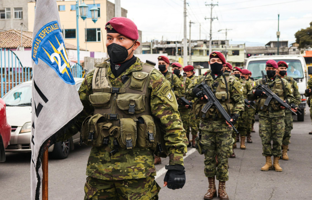 Military personnel patrolling a city street