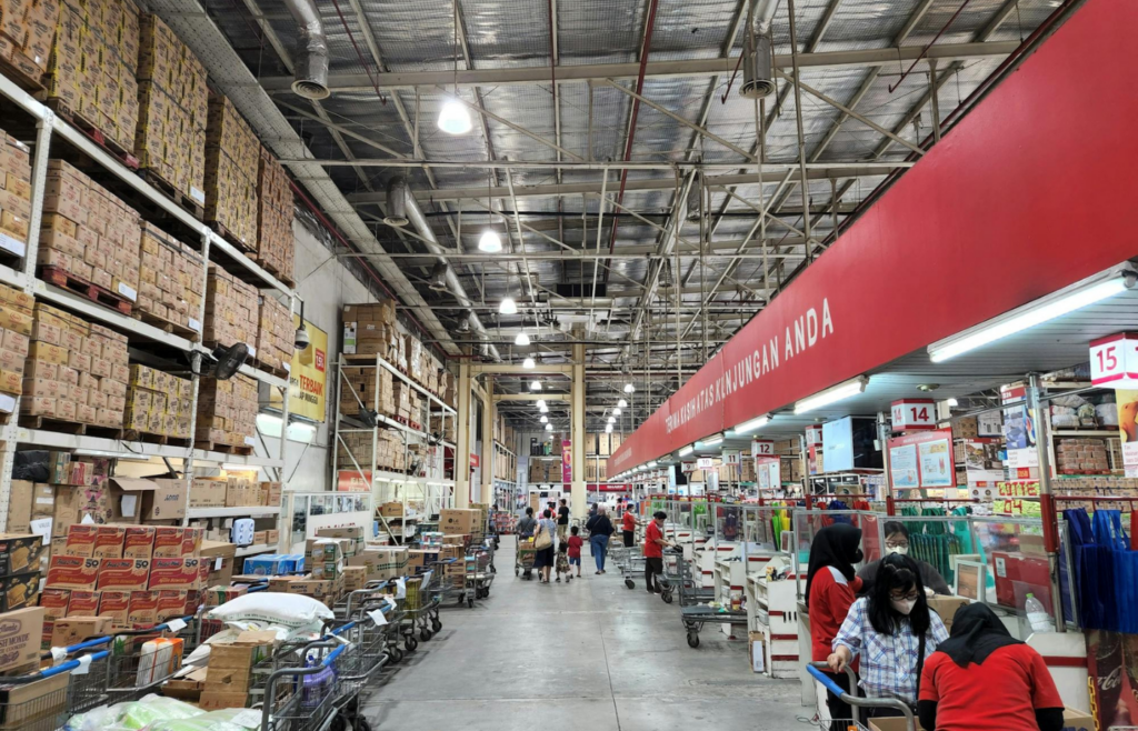 Pantry shelves with bulk-bought canned goods and supplies