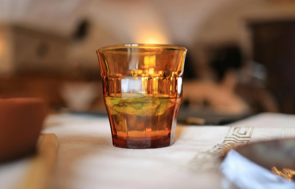 Glass of water with a brownish tint