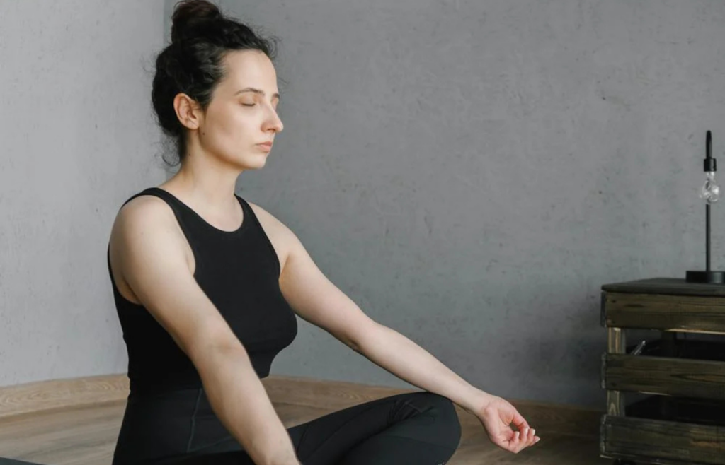 Individual practicing yoga in a living room