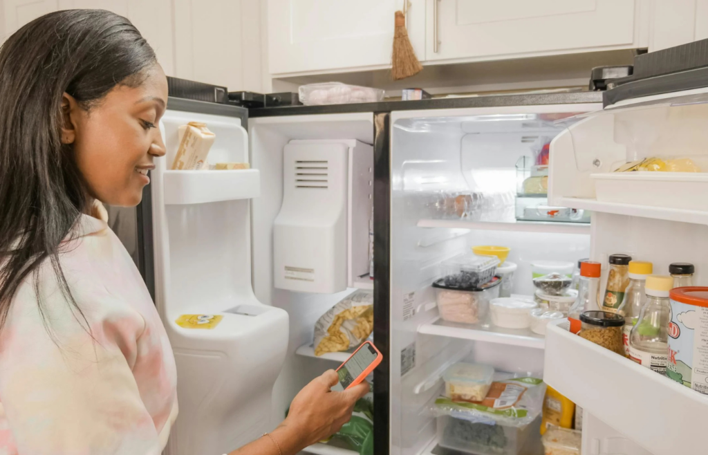 Spoiled food in an open refrigerator