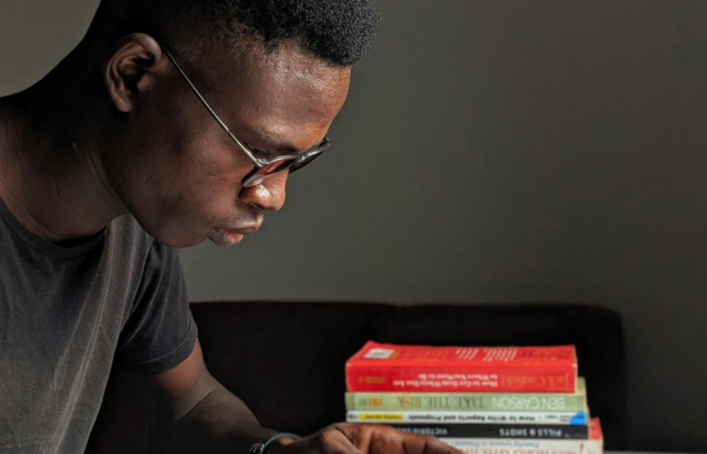 A person reading a book, symbolizing continuous learning