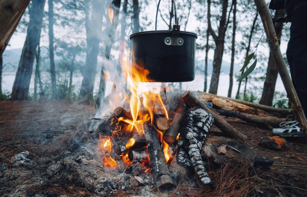 Campfire with a pot hanging over flames
