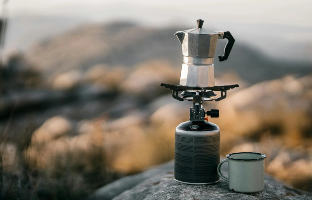 Portable rocket stove with a pot on top