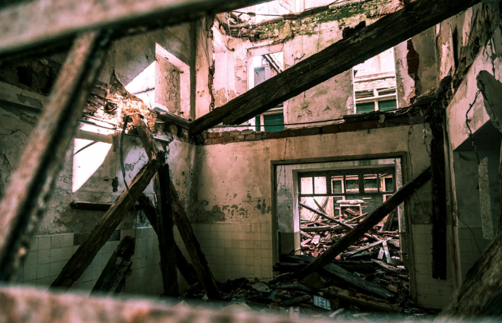 Collapsed section of a building with exposed beams