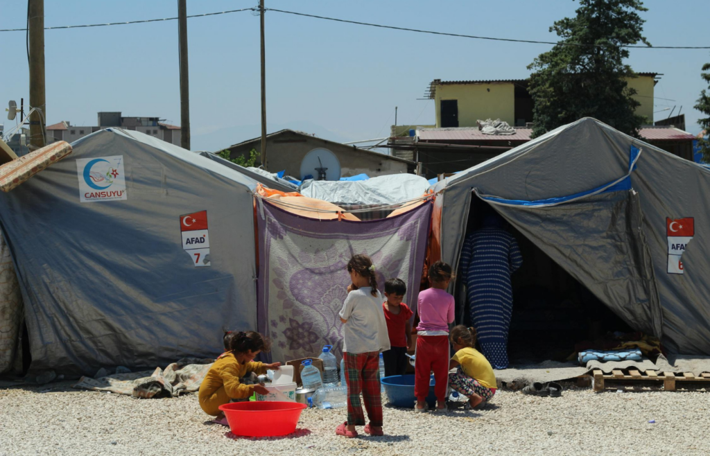  Crowded emergency shelter with families occupying close quarters