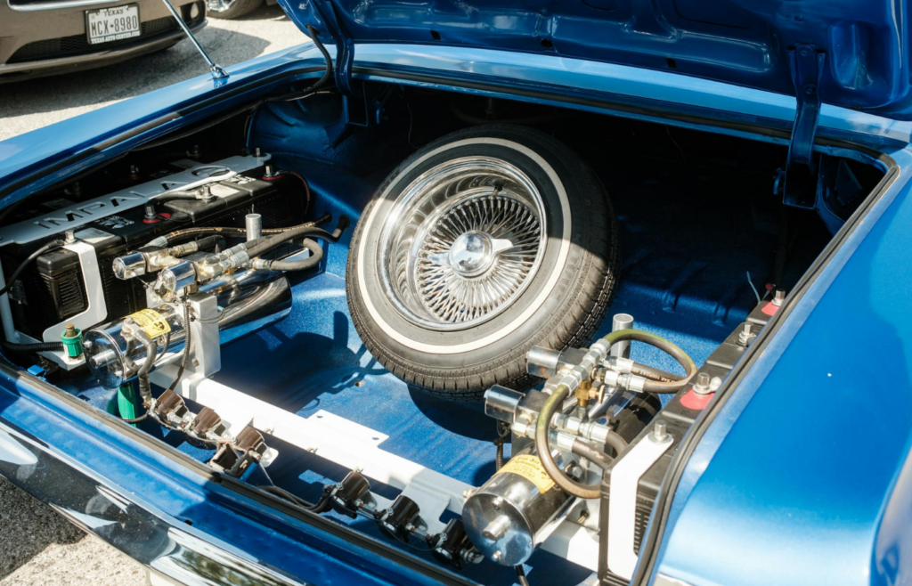 Spare tire and tools neatly arranged in a car trunk