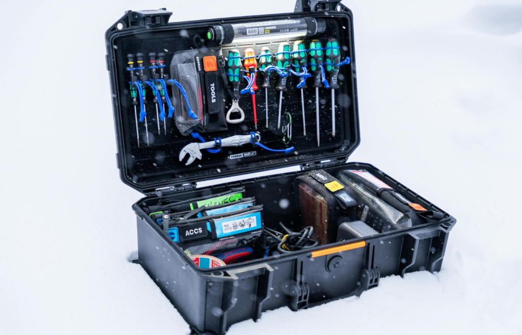 Open tool kit with wrenches, pliers, and screwdrivers