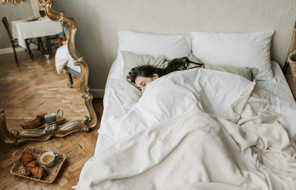 A person peacefully sleeping in bed