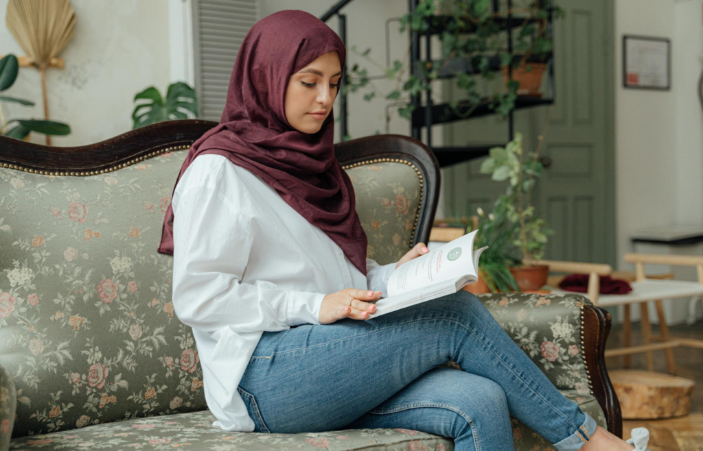 An individual reading a book instead of using electronic devices