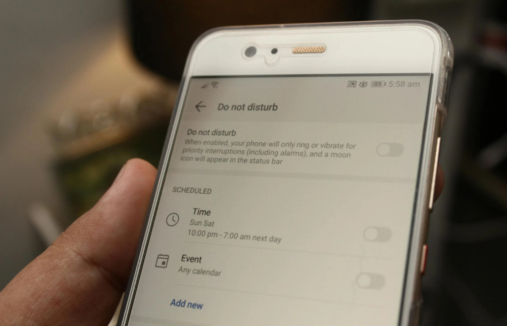 Person turning off notifications on a smartphone