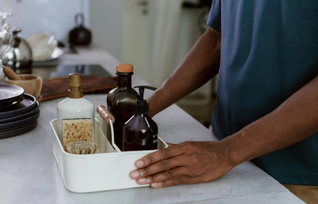 Container of moist towelettes on a kitchen counter