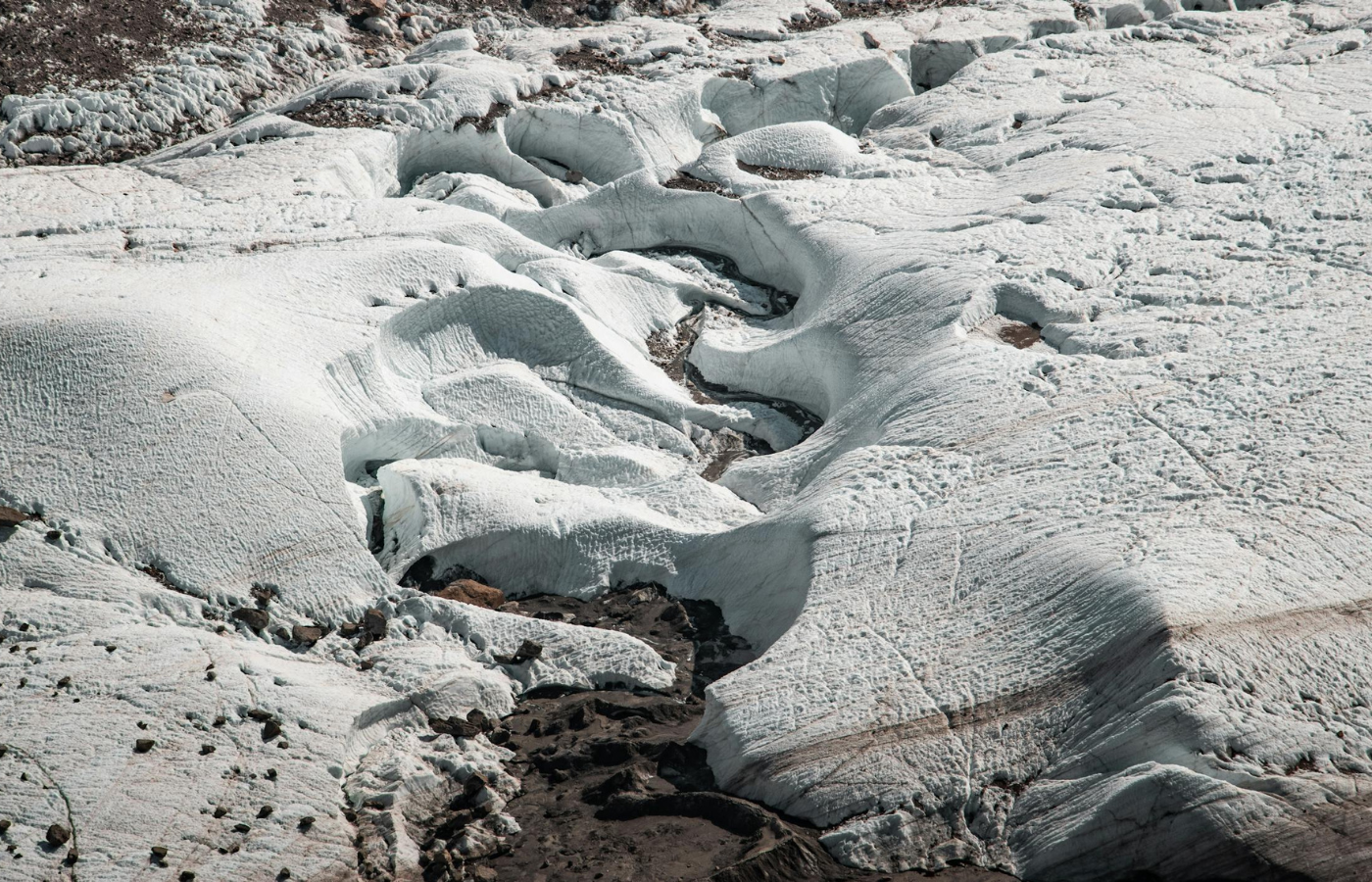 Glacial terrain with cracks on snow