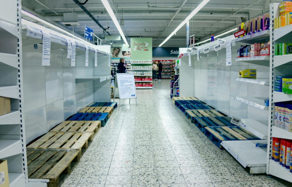 Empty shelves in a store before a forecasted storm