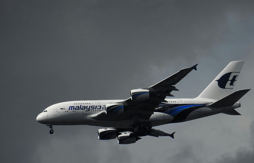 White Malaysian Airlines Under White Clouds