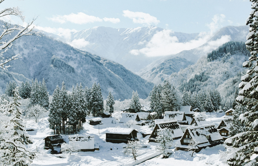 Picturesque snowy village in mountain landscape
