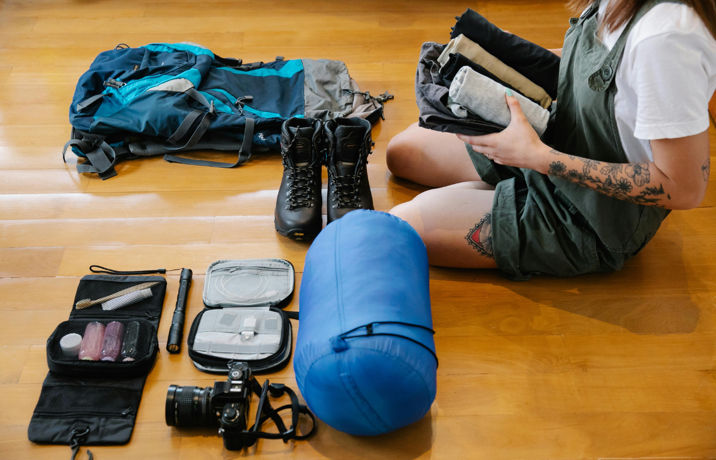 Woman Sitting on Floor While Packing Up