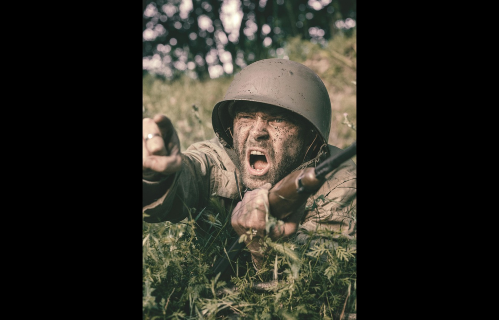 Soldier on the ground holding a rifle