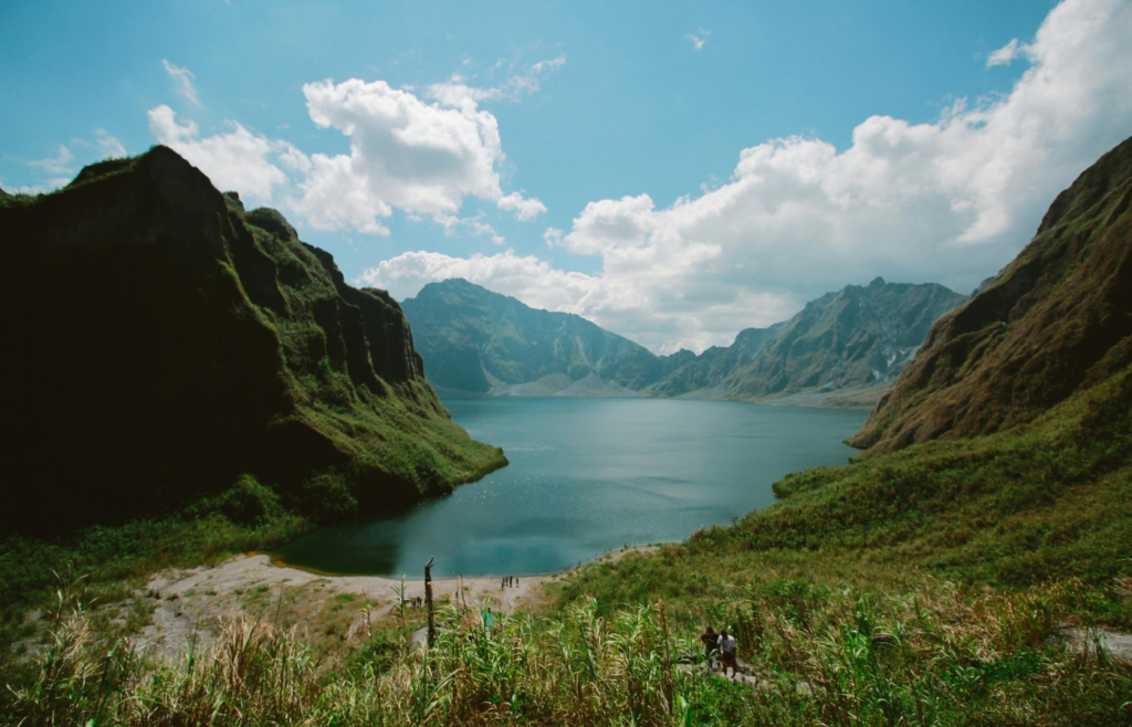Photography of mountains near body of water