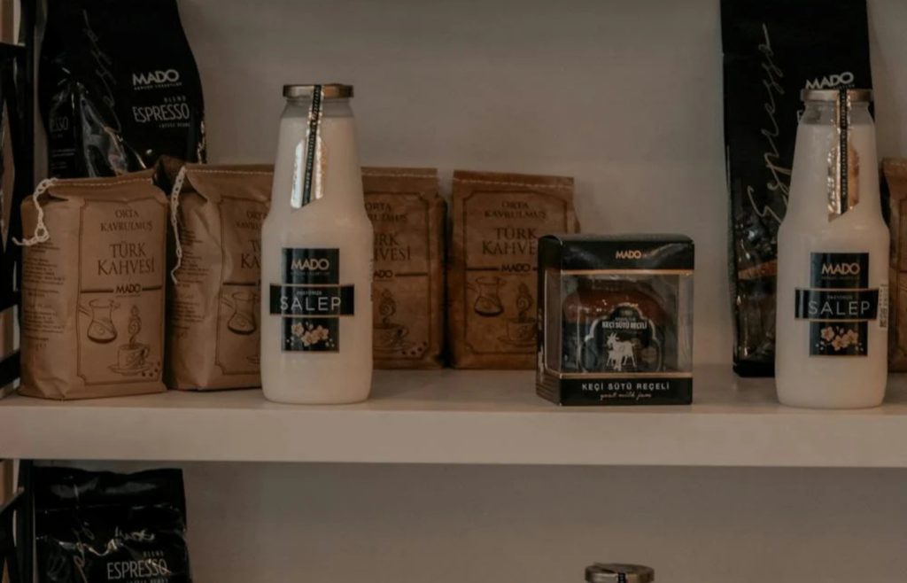 Bottles of various types of vinegar on a pantry shelf