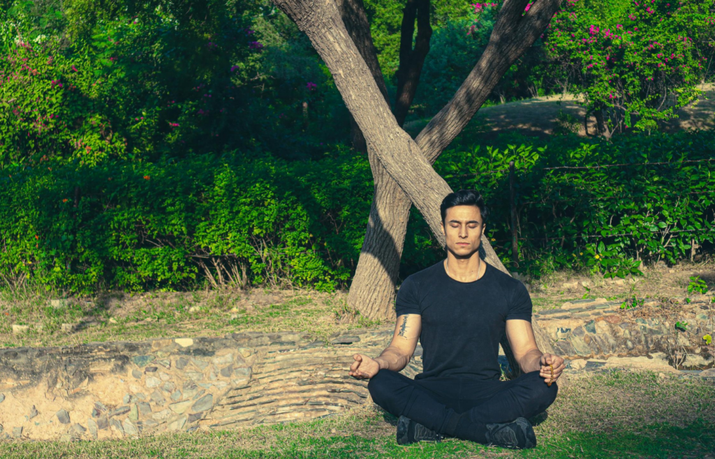 A person sitting quietly and deep breathing