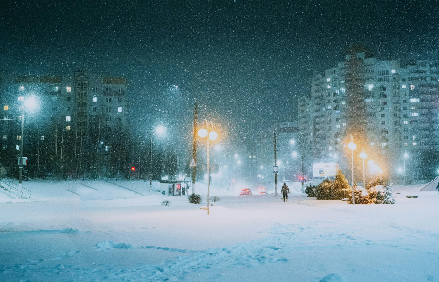 A winter storm rapidly rolling in over a town