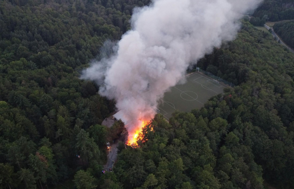 Large-scale fire ravages forest area