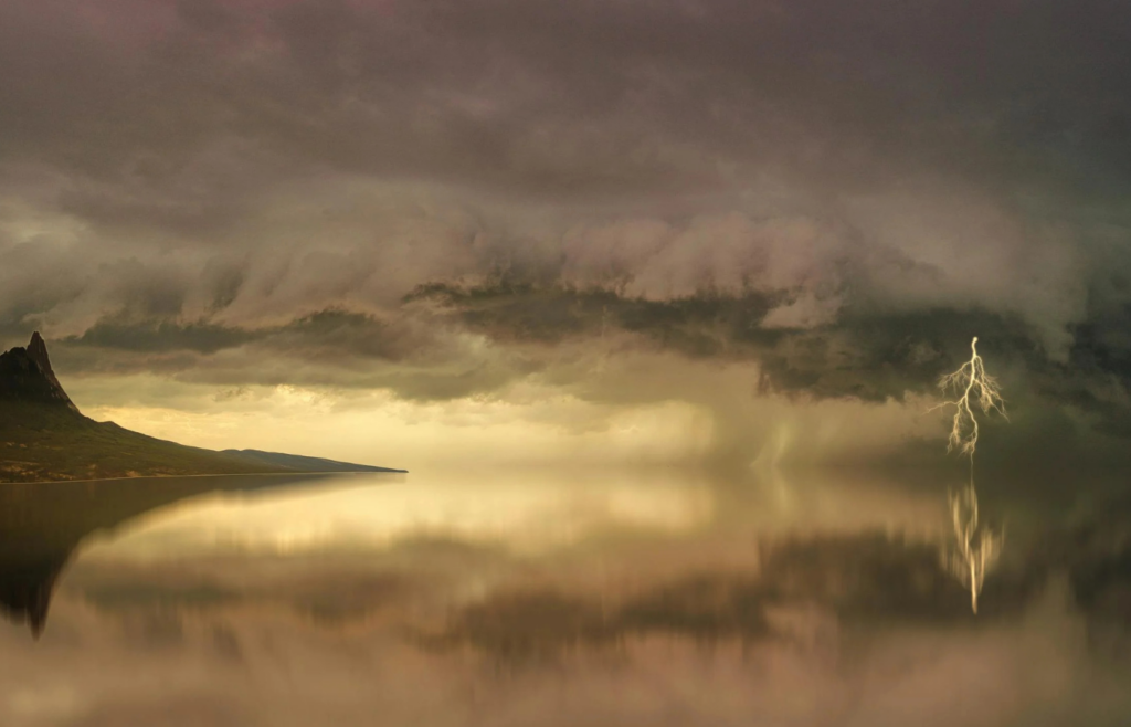 A high-altitude mountain peak struck by lightning
