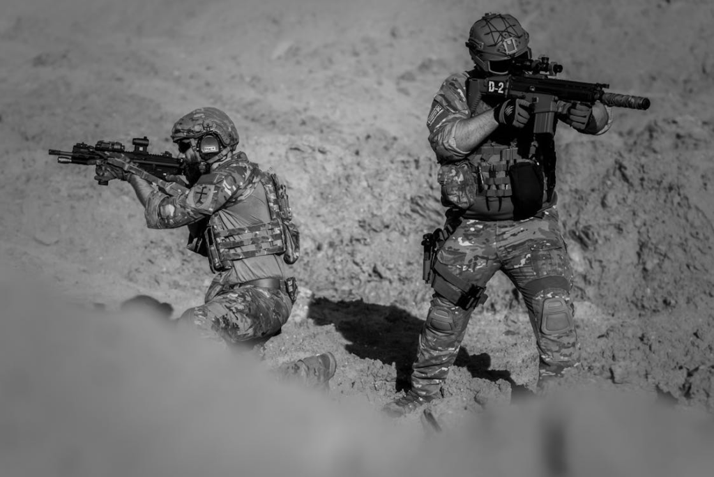 2 person in army suit grayscale photography