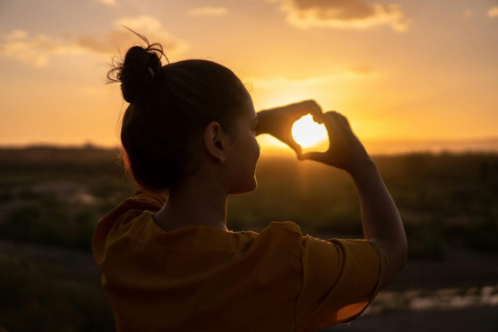 woman doing heart sign