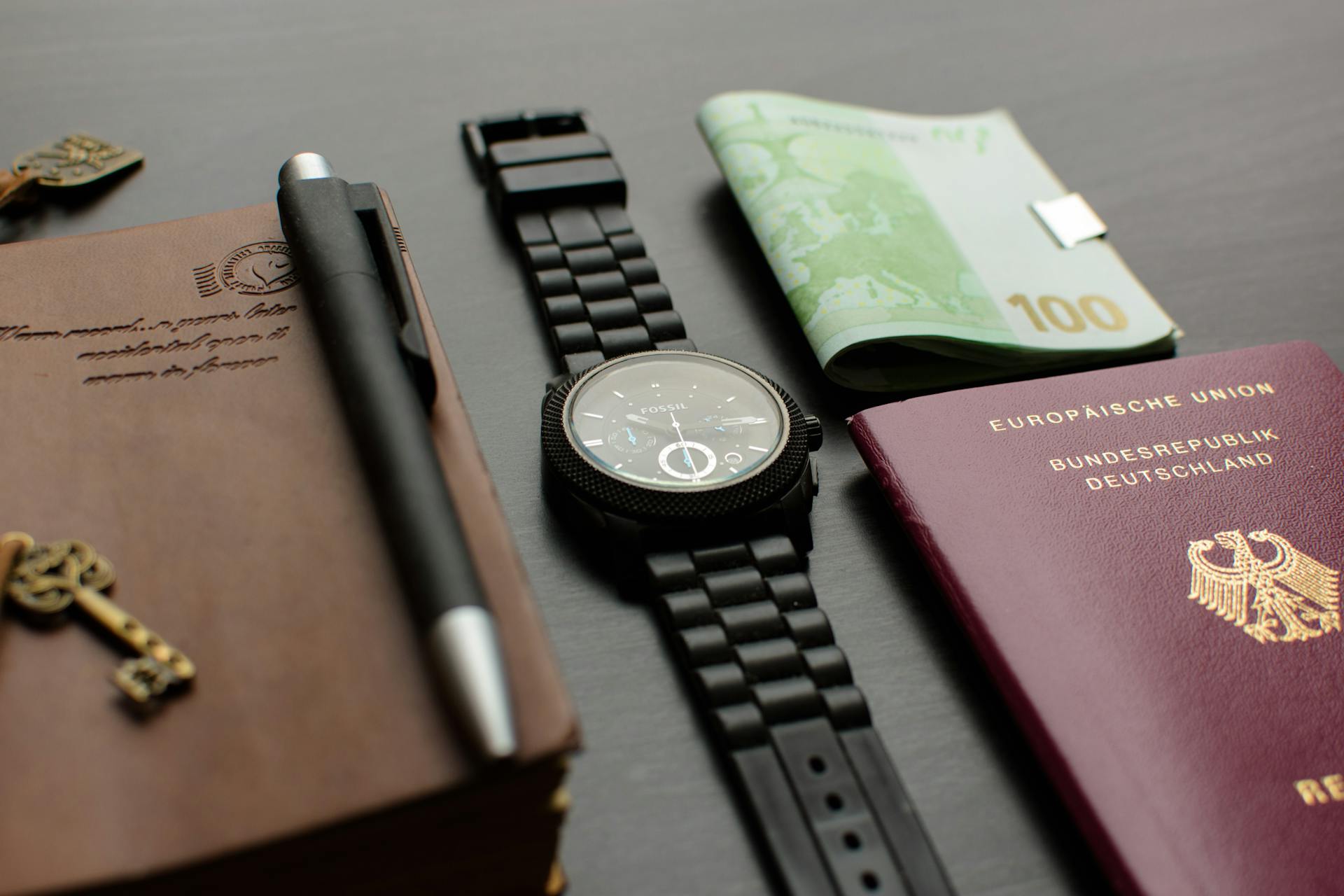 passport and watch on table